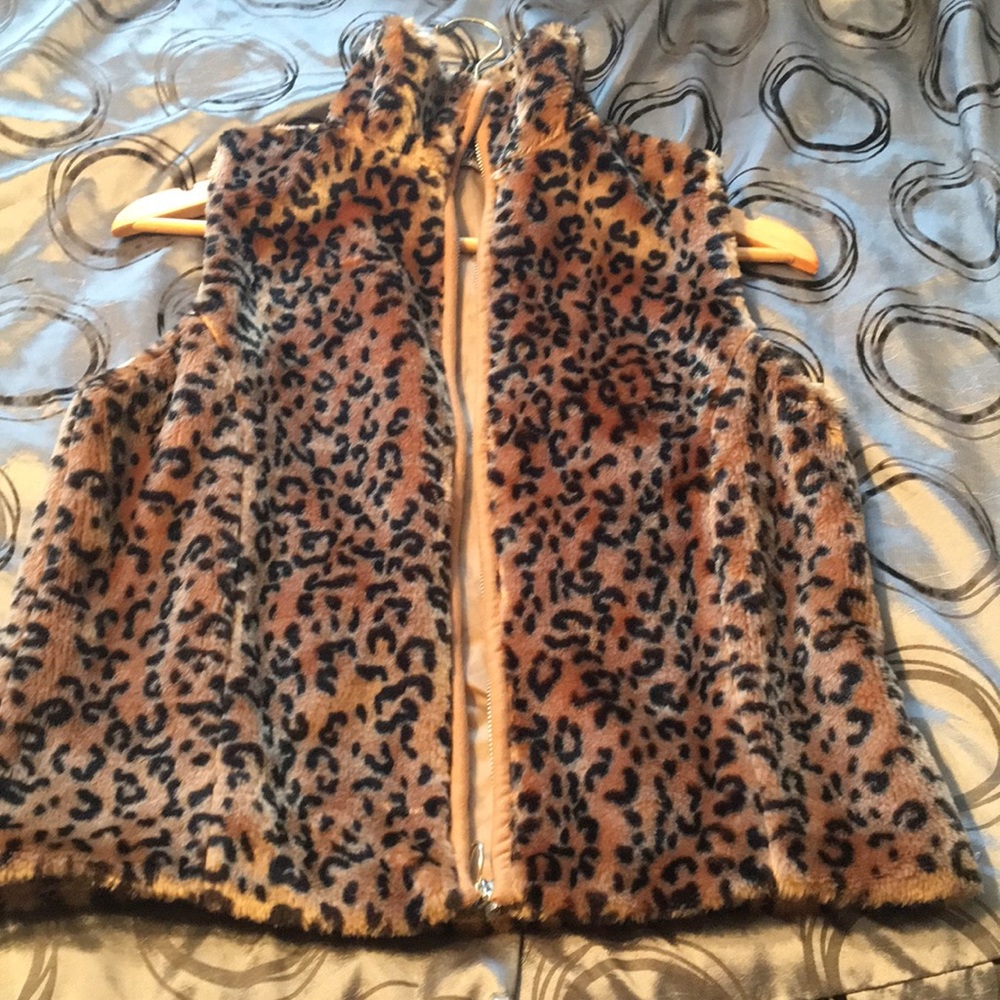 Faux leopard print vest.